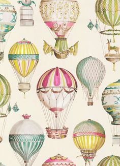 a group of hot air balloons flying in the sky with different shapes and colors on them