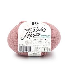 pink ball of yarn with the label for 100 % baby abaacca on it