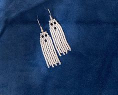 Already made white and black seed bead ghost fringe earrings. The earring hook is coloured silver. Made by a Métis beader in Canada Bead Ghost, Seed Bead Fringe Earrings, Bead Fringe Earrings, Bead Fringe, Earring Hook, Le Crochet, Black Seed, Beaded Fringe, Halloween Ghost