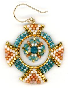 a pair of earrings with beads on them