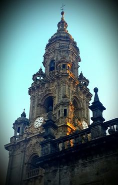 an old building with clocks on the side