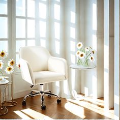 a white chair sitting in front of a window next to a table with flowers on it