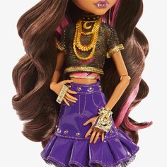 a doll with long brown hair wearing a purple skirt and gold jewelry on it's head