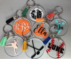 a bunch of key chains with different designs on them