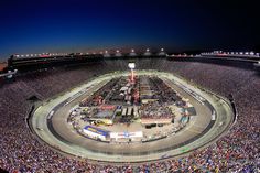 an aerial view of a race track at night