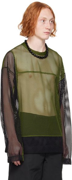 Semi-sheer polyester mesh T-shirt. · Paneled construction · Crewneck · Dropped shoulders Supplier color: Green Green Sheer Mesh Top, Sheer Green Mesh Top, Green Mesh Crew Neck Top, Sheer Mesh T-shirt For Spring, Green Mesh Casual Top, Mesh Tops With Mesh Sleeves For Streetwear, Summer Green Tops With Sheer Sleeves, Casual Green Sheer Mesh Top, Summer Green Top With Sheer Sleeves