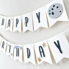 a happy birthday banner is hanging on the wall