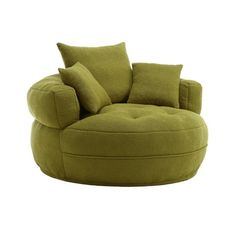 a large green chair with pillows on it