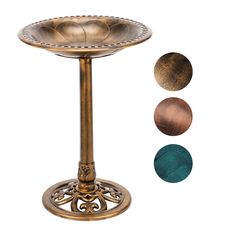 an ornate brass pedestal with three different colors