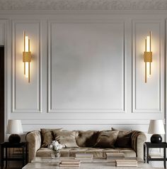 a living room with couches, lamps and tables in front of a wall that has white paneling