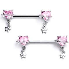 two piercings with pink crystal stones and stars on the end, one is attached to a