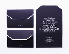 two black and white business cards on top of each other, with the same design