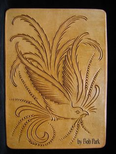 a wooden plaque with an image of a bird on it