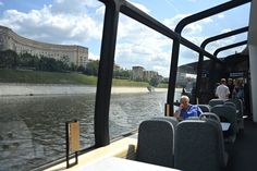 people are riding on a boat in the water