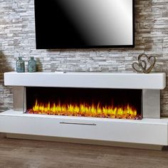 a modern fireplace with bright flames in the center and a flat screen tv above it