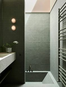 a bathroom with a sink, mirror and bathtub