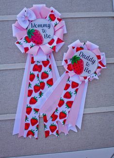 two ribbons with strawberries on them and the words mommy to be written on them