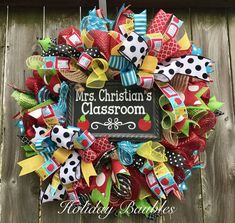 a colorful wreath with the words mrs christian's classroom on it and lots of bows