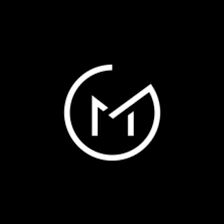 the letter m in a circle on a black background