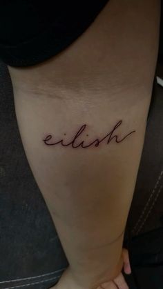 a woman's foot with the word ellosh written in cursive writing