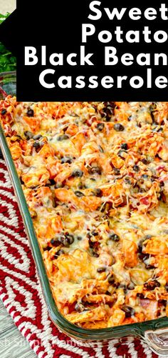 sweet potato black bean casserole in a glass baking dish on a red and white tablecloth