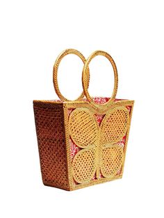 The Ata Butterfly Tote Bag stands out with its whimsical butterfly design. It adds a touch of fun and elegance to your beach ensemble, making it a fashion statement. When you open the bag, you'll be greeted by a bright paisley print fabric lining that peeks through the wicker folds. This interior design not only adds a pop of color but also creates a cheerful and beachy atmosphere. Crafted from rattan, this handbag is the epitome of summer chic. The natural texture of rattan perfectly complement Designer Summer Travel Bags, Designer Travel Bags For Summer, Designer Summer Straw Bag For Daily Use, Designer Rectangular Straw Bag For Summer, Rectangular Shoulder Bag As Summer Gift, Rectangular Shoulder Bag As A Summer Gift, Summer Square Straw Bag With Detachable Handle, Trendy Red Rectangular Beach Bag, Designer Summer Beach Bags