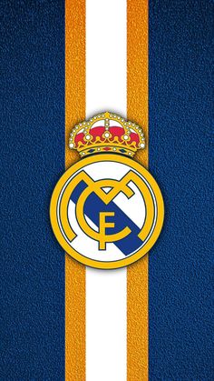 the real madrid logo on a blue, yellow and white striped wallpaper with a crown