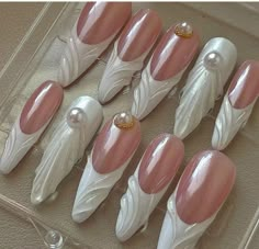 there are six pairs of fake nails with pearls on them