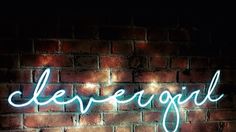 a brick wall with a neon sign on it that says,'le beregull '