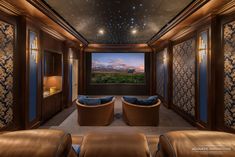 a home theater with two seats and a projector screen in the middle of the room