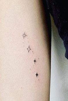 a woman's arm with stars on it