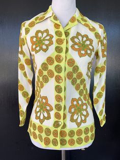 1960s Alex Colman blouse. White, orange, green and yellow rayon. Dry clean or hand wash. Five button front. Measurements  34" bust 30" midriff 34" hem 25" length 21" sleeves 13" shoulders Lovely blouse shows well.  A pattern printing irregularity is noted on the back as shown in pics. Womens Blouses, Blouse White, Green And Yellow, Green And White, Womens Clothing Tops, Favorite Outfit, 1960s, Blouses For Women, Art Collection