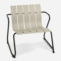 a white chair with four black legs on a white background and no one is sitting in it