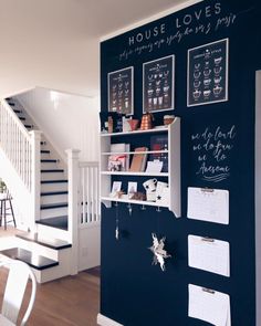 there is a chalkboard on the wall in this dining room that has been decorated with pictures and writing