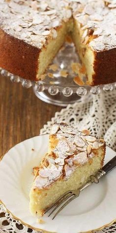 a piece of cake on a plate with a fork in front of it and another slice missing