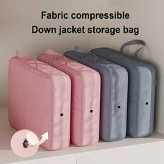 four suitcases are lined up on a shelf with the words fabric compressible down jacket storage bag