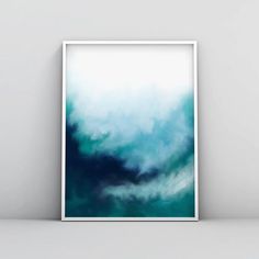 an abstract painting with blue and green colors on the wall in front of a white frame