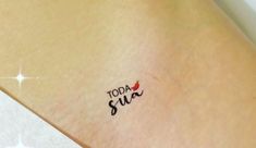 a small tattoo on the back of a woman's left arm that says today supa