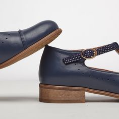 Leather; upper & lining Man-made sole 2.5 cm / 1.0" heel height Handcrafted in Europe Materials: These mary jane shoes are crafted from soft blue leather with a stylish polka suede strap. Featuring traditional punch-hole, delicate strap and tiny gold-toned buckle fastener, they are comfortable and versatile. Leathers: Navy Blue Soft, Blue Dots Velvet Buckle: Gold Decorations: Brogues & Perforations Sole: Beige #1685 CUSTOMIZEBANNER6567772417_ Gold Decorations, Custom Made Shoes, Blue Dots, Fashion Aesthetics, Blue Soft, Jane Shoes, Blue Dot, Women Artisans, Mary Jane Shoes