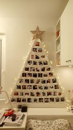 a christmas tree made out of photos and lights