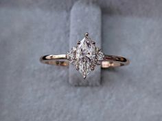 an engagement ring with three diamonds on it