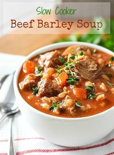 slow cooker beef barley soup in a white bowl