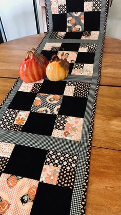 a table runner with pumpkins on it