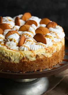 there is a cake with white and orange toppings on it, sitting on a plate