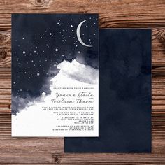 a black and white watercolor wedding card with the moon in the sky above it