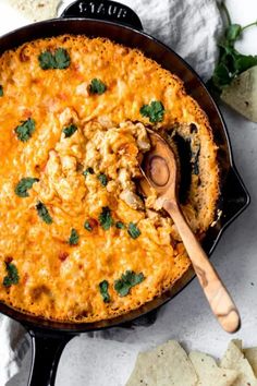 a skillet filled with chicken and tortilla chips