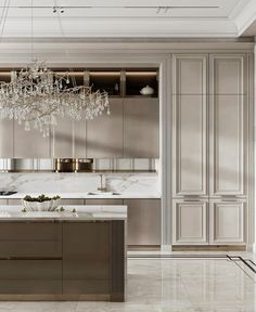 an elegant kitchen with marble counter tops and gold trimmings, chandelier hanging from the ceiling