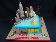 a birthday cake that is shaped like the new york city skyline