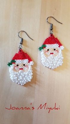 a pair of beaded santa claus earrings