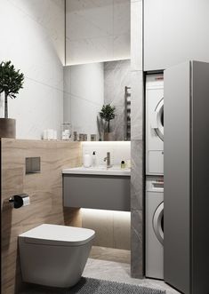 a bathroom with a toilet, sink and washer